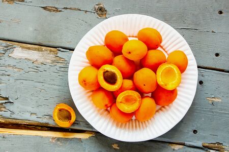 Flat-lay of apricot fruit on wooden table. Local farmers produceの写真素材