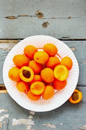 Tasty apricot fruit on wooden table flat-lay. Local farmers produce top viewの写真素材