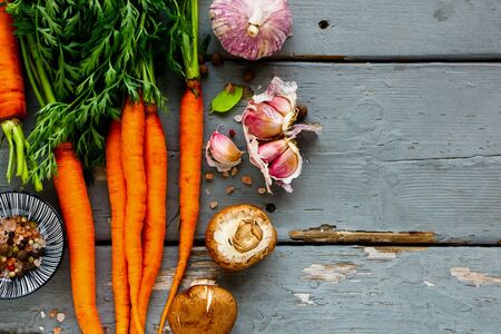 Fresh Carrots bunch and vegetable ingredients. Healthy food cooking background.の写真素材