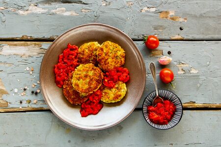 Homemade meatless cutlets with lentil and rice on wooden table flat layの写真素材
