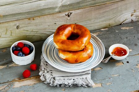 Tasty Breakfast set with whole grain bagels, fresh berries and fruit spreadの写真素材