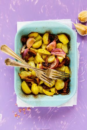 Flat-lay of baked potato with mushroom and onion from aboveの写真素材