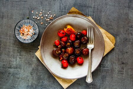 Grilled vegetables and mushrooms on dark vintage background の写真素材