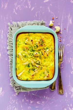 Delicious Cauliflower Gratin in baking dish flat lay from aboveの写真素材