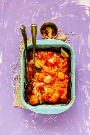 Baked salmon fish in baking dish flat layの写真素材