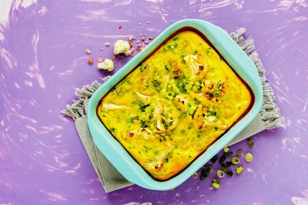 Homemade Cauliflower Gratin in baking dish flat lay from aboveの写真素材