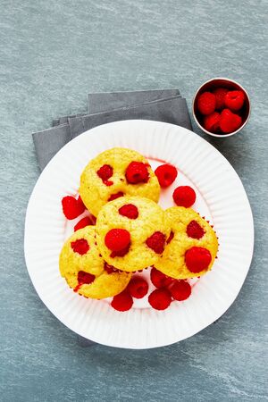 Tasty raspberry muffins with fresh berries flat-layの写真素材