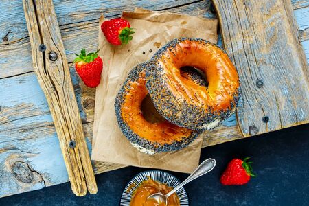 Breakfast bagels, salted caramel spread and strawberries close-upの写真素材