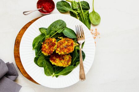 Fresh spinach and vegetable pancakes on plate close-upの写真素材