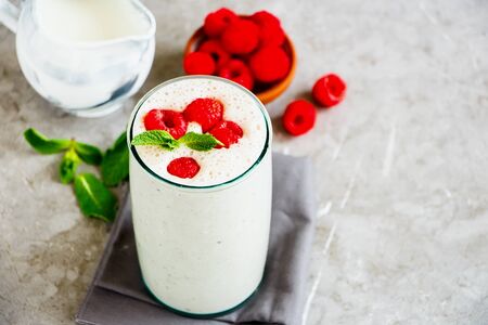 Raspberry yoghurt smoothie in glass jar close-upの写真素材