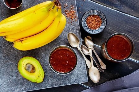 Avocado, chocolate, banana smoothie jars top viewの写真素材