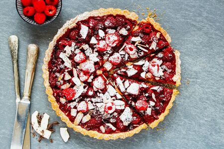 Homemade sliced raspberry chocolate tart top viewの写真素材