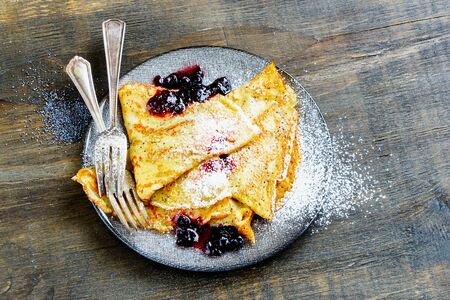 Close-up of poppyseed pancakes with wild blueberry jamの写真素材
