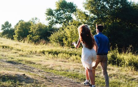 Happy loving couple embracing outdoors at summertime. Couple love. Man and woman nature.の写真素材