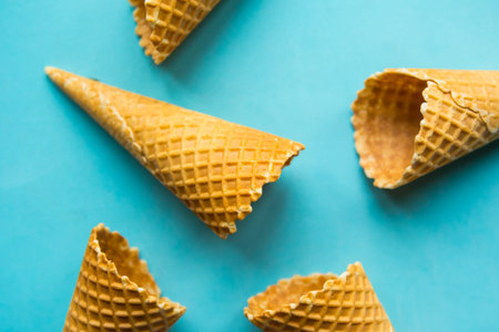 Waffle cones on blue background