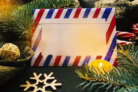 Christmas composition with Christmas tree branches, post card and copy space for the textの写真素材