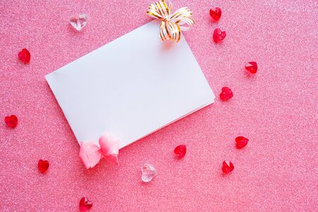 White mockup blank on pink background. Valentine's Day greeting cardの写真素材