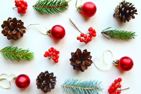 Christmas pattern with cones, red baubles and spruce branchesの写真素材