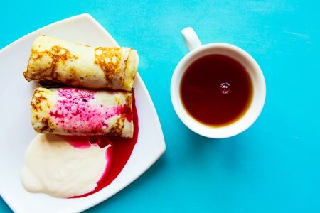 tasty homemade pancakes with sour creamの写真素材