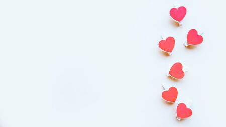 Red hearts on white background. Flat lay, top view, copy space. Valentine's Day greeting cardの写真素材