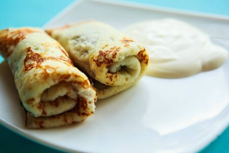 tasty homemade pancakes with sour creamの写真素材