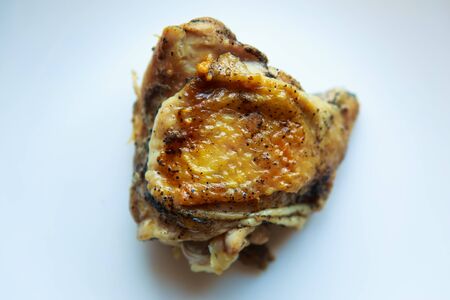 piece of fried chicken on white plateの写真素材