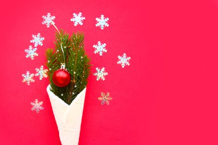 Christmas tree branches with decorations in waffle cone. Merry Christmas and Happy New Year. Copy spaceの写真素材