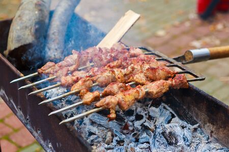 Shish kebab roasting on the grill. BBQ outdoor, top viewの写真素材