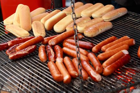 Hot dog buns and sausages grilled at parkの写真素材