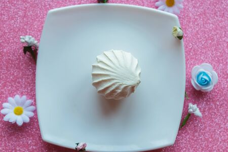 White zephyr or marshmallow on white plate, top viewの写真素材