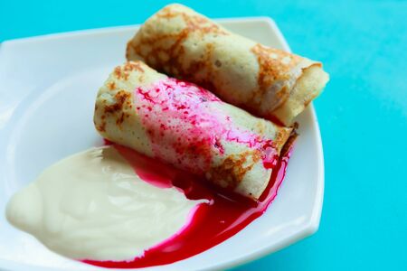 Tasty homemade pancakes with sour cream and jam, closeupの写真素材