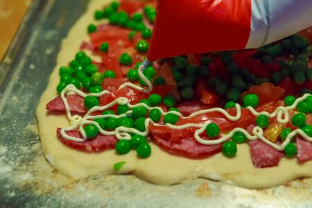 Tasty homemade pizza with sausage and vegetablesの写真素材