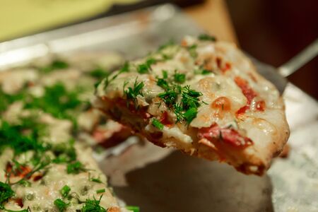 Tasty homemade pizza with sausage and vegetables, ready to eatの写真素材
