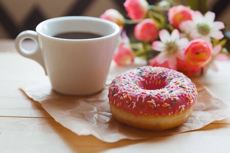 Strawberry donut and coffee cup on the table. Valentine's day concept
の写真素材