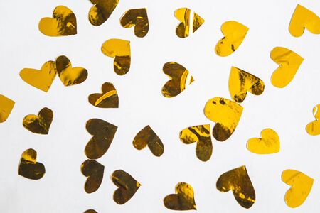 Golden hearts on white background. Valentine's Day abstract backgroundの写真素材
