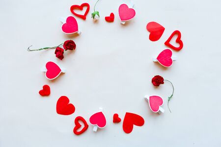 Round frame of hearts on white background, flat lay, top view, copy space. Valentine's day greeting cardの写真素材