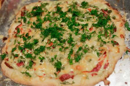 tasty homemade pizza with vegetables and salami, top viewの写真素材