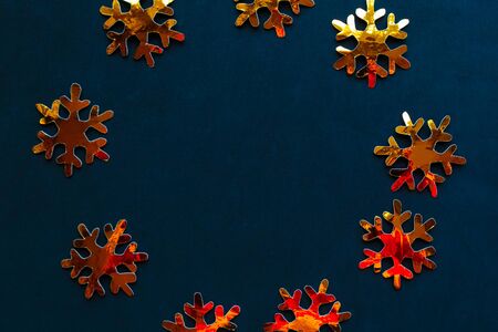 Golden decorations on black background. Flat lay, top view, copy space. Merry Christmas and Happy New Yearの写真素材