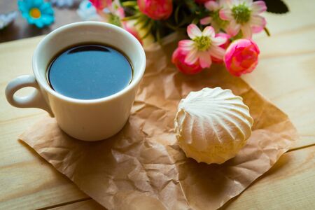 coffee cup and zefir on wooden background, top viewの写真素材