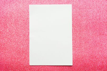 white mockup blank on pink glitter backgroundの写真素材