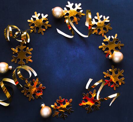 Wreath of golden decorations on black abckground. Christmas greeting cardの写真素材