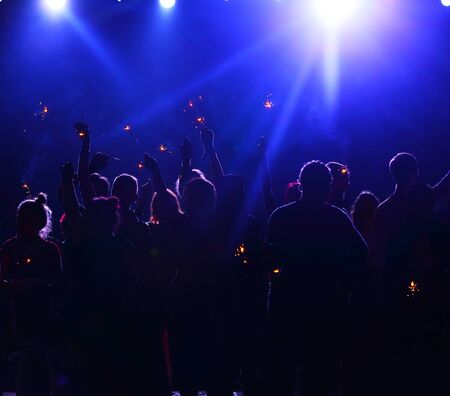crowd of people at night open air festivalの写真素材