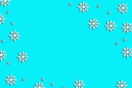 white snowflakes on blue background, flat lay, top view, copy space, Xmas abstract backgroundの写真素材