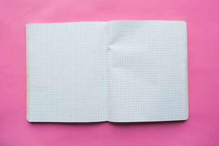 Open notebook on pink backgroundの写真素材