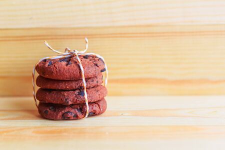 chocolate chip cookies stack on wooden background, copy spaceの写真素材