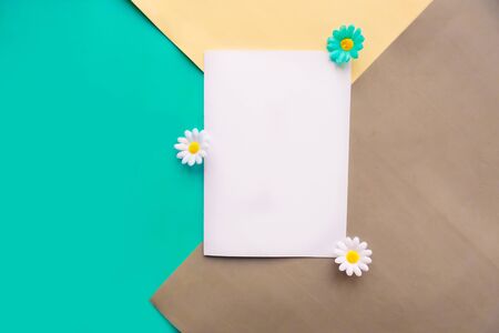 Women's Day mockup greeting card with decorative flowers on geometric gray, blue and white backgroundの写真素材