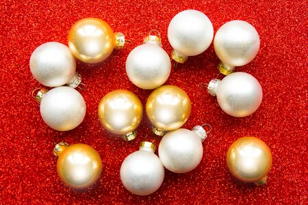 Christmas baubles on bright red backgroundの写真素材