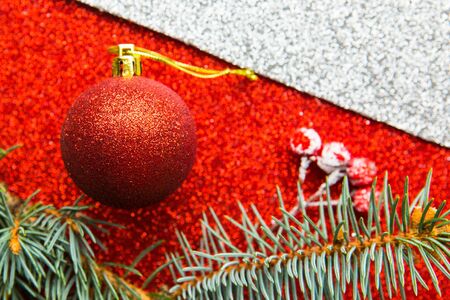 Christmas ball on bright red backgroundの写真素材