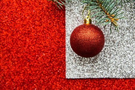 Christmas ball on bright red backgroundの写真素材