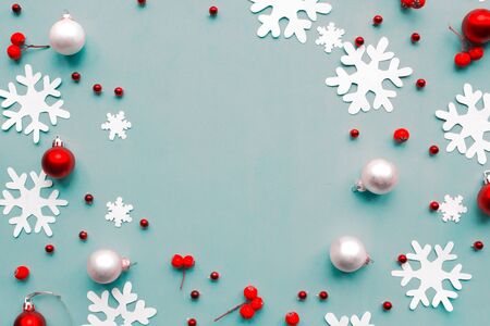 Merry Christmas and Happy New Year. Flat lay photo with Christmas decorations on blue background. Xmas greeting card, banner. Copy space for the textの写真素材
